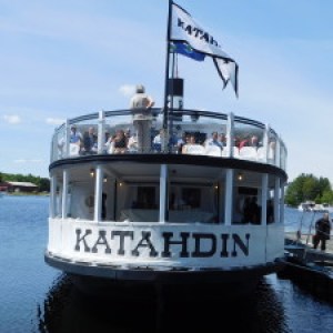 a boat is docked next to a body of water