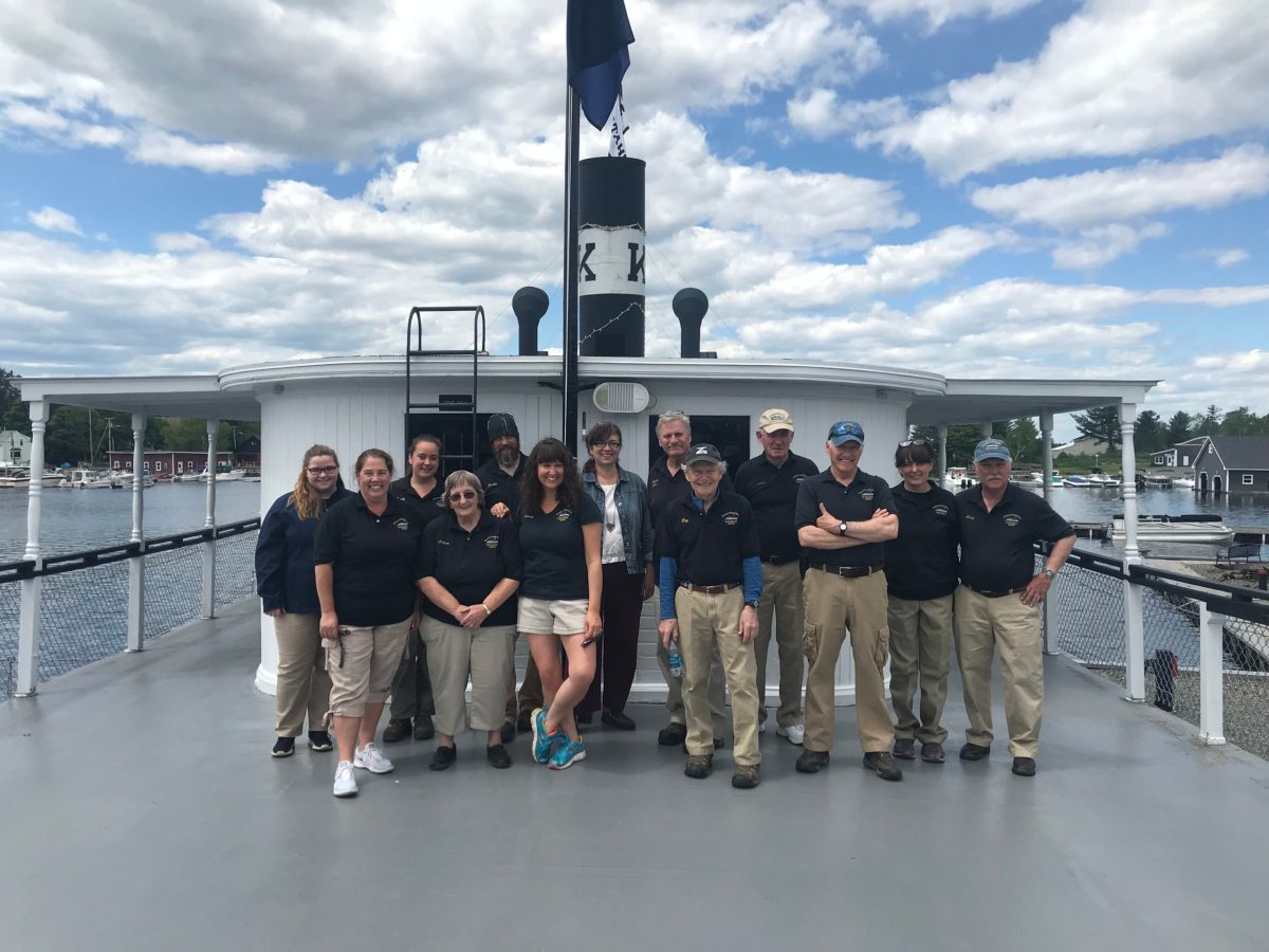 Crew 2 a group of people posing for a picture