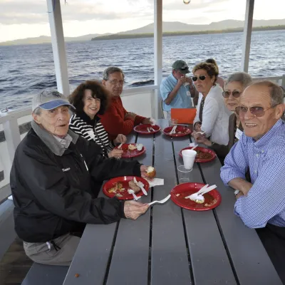 a group of people sitting at a beach