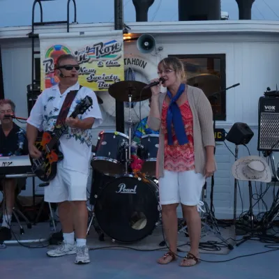 a group of people standing around each other