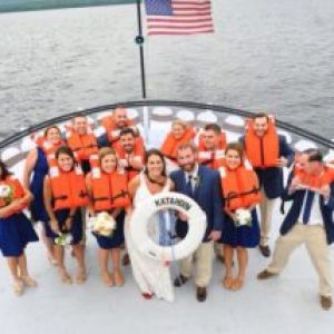 a group of people in a boat on a body of water
