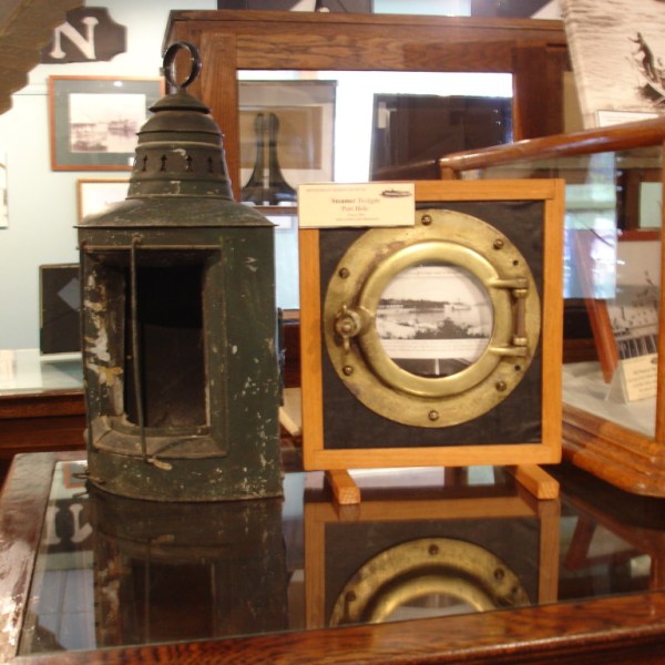 a clock sitting on top of a wooden table